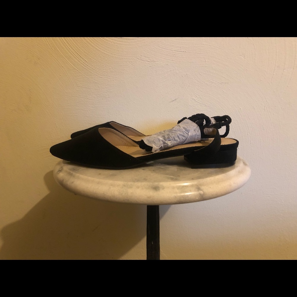 Black flats with leg wraps